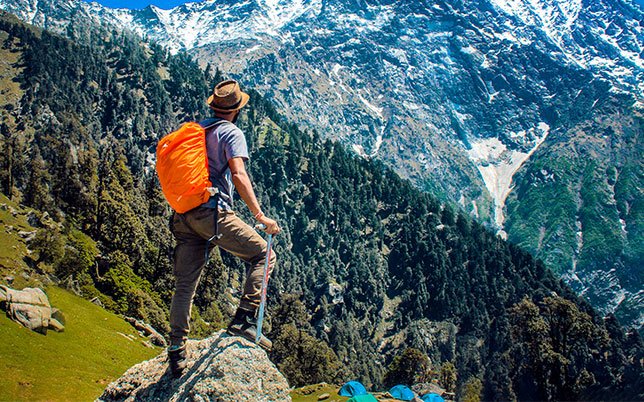 A hiker enjoying mountains view