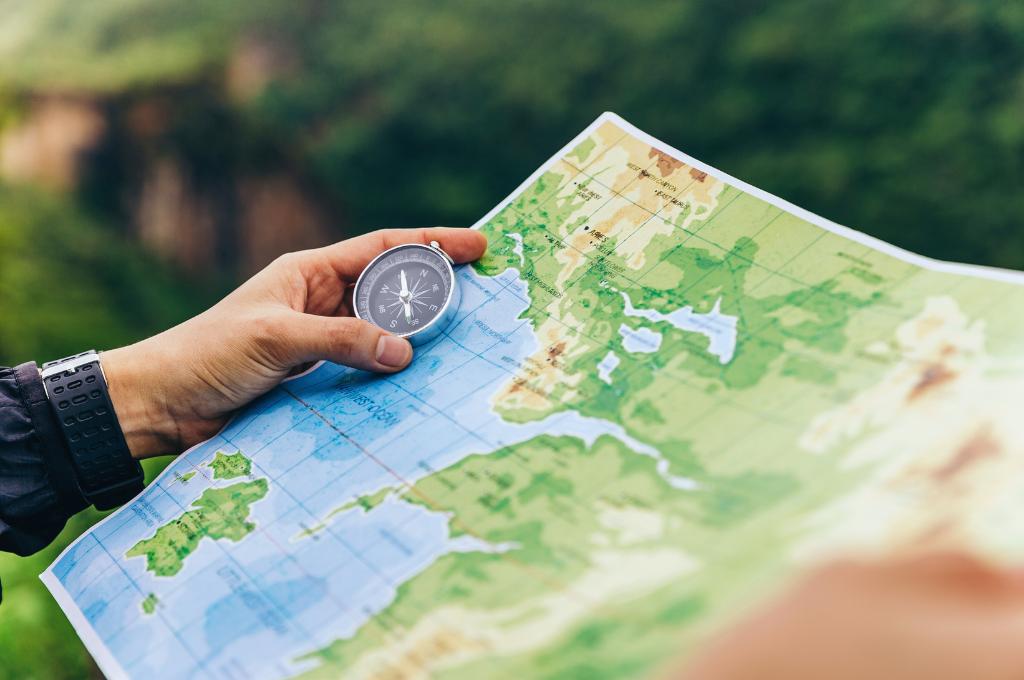 compass and map in the hands of a traveler