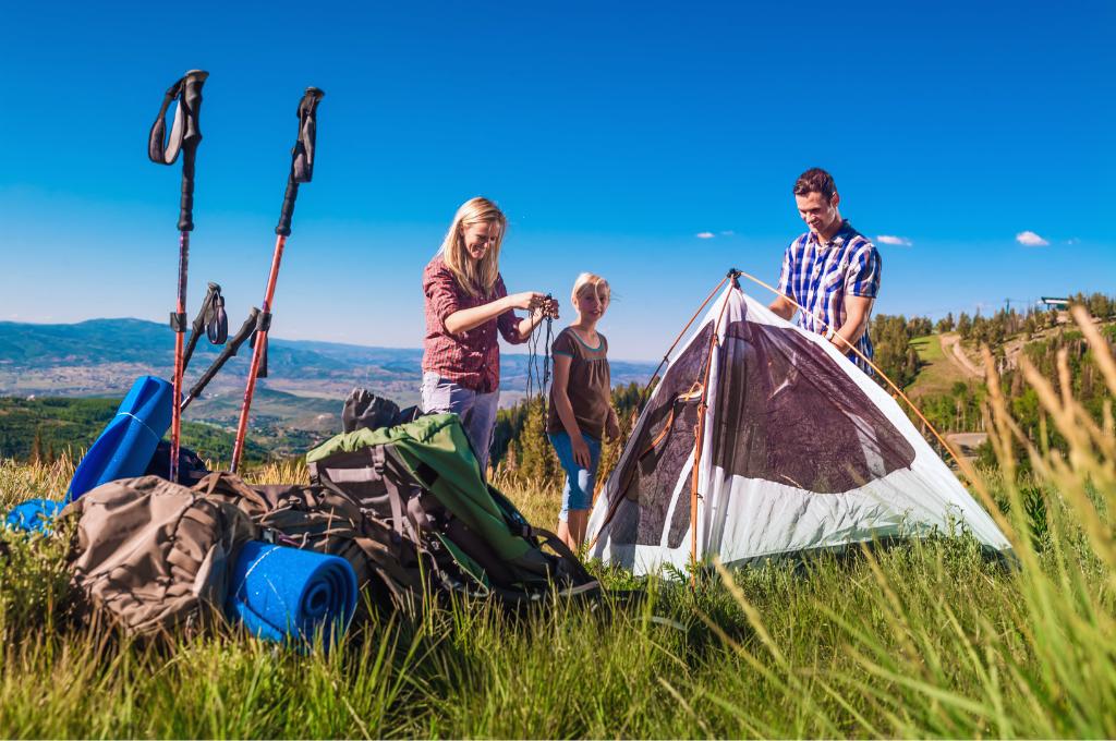 a family camping and backpacking on the mountains